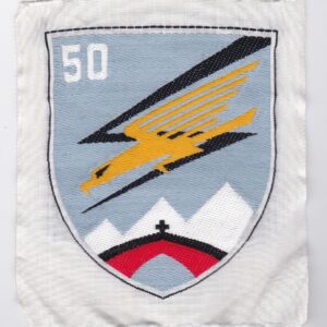 A patch with an eagle and mountains on it.