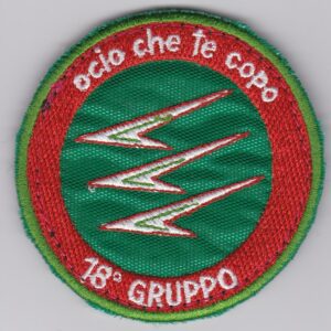 A red and green patch with the words ecco che te corpo.