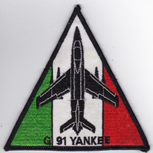 A triangle patch with the word yankee on it.