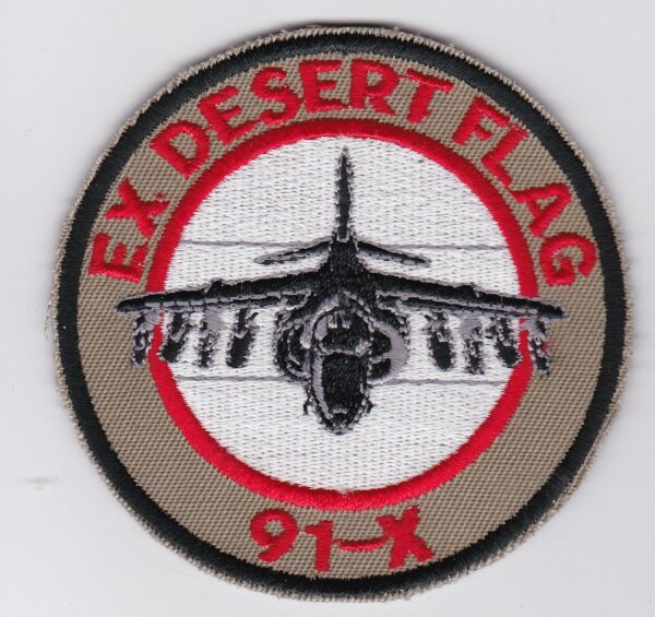 Ex desert flag patch with an airplane on it.