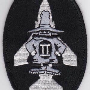 A patch with an image of a man in a hat.