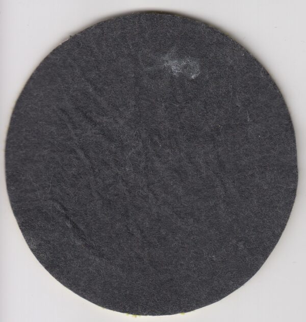 Black circular fabric patch with fuzz.