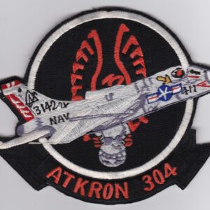 A patch with the words akron 3034 on it.