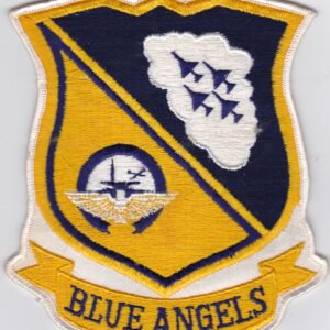 A blue angels patch on a white surface.