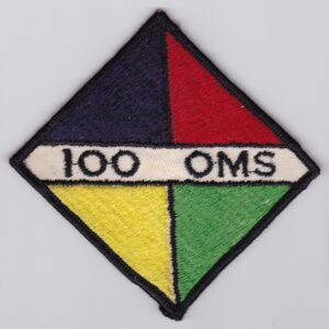 A 100 oms patch on a white surface.