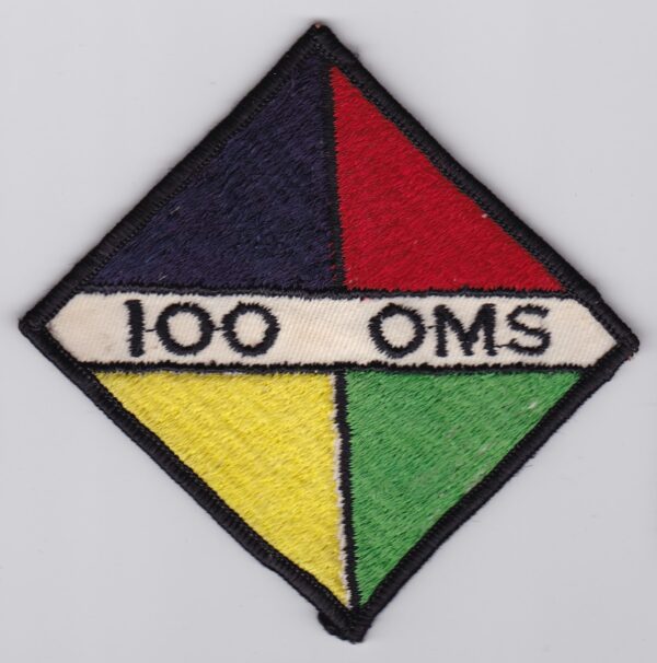 A 100 oms patch on a white surface.