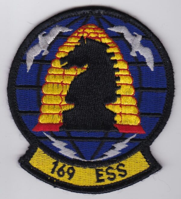 A patch with the word ess on it.