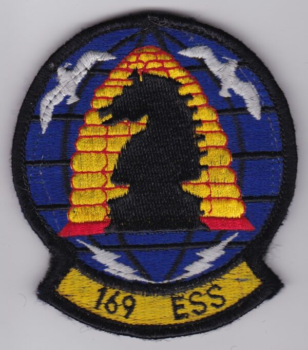 A patch with the word ess on it.