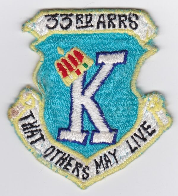 A patch with the words k that others may live.