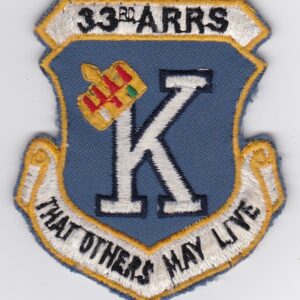 A patch with the word k that others may live on it.