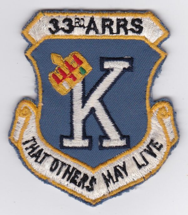 A patch with the word k that others may live on it.