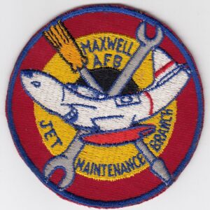 A patch with a plane and tools on it.