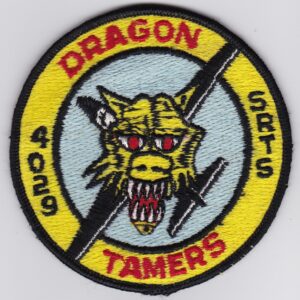 A dragon tamer patch with the words dragon tamer.