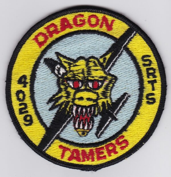 A dragon tamer patch with the words dragon tamer.