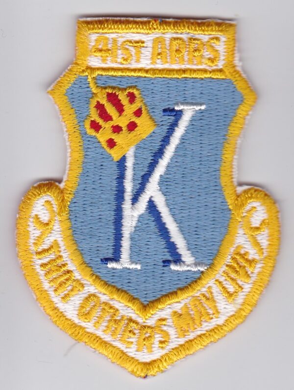 A patch with the letter k on it.