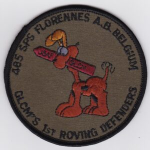 A patch with an image of a dog holding a gun.