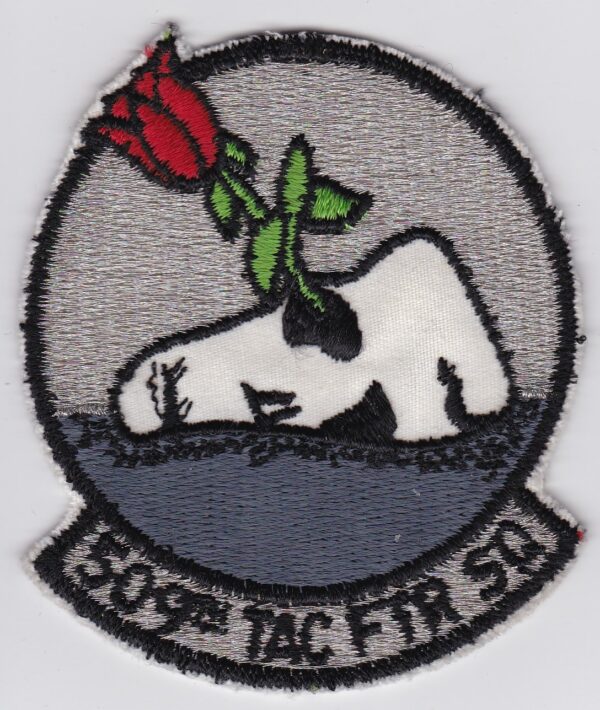 A patch with a rose on it.