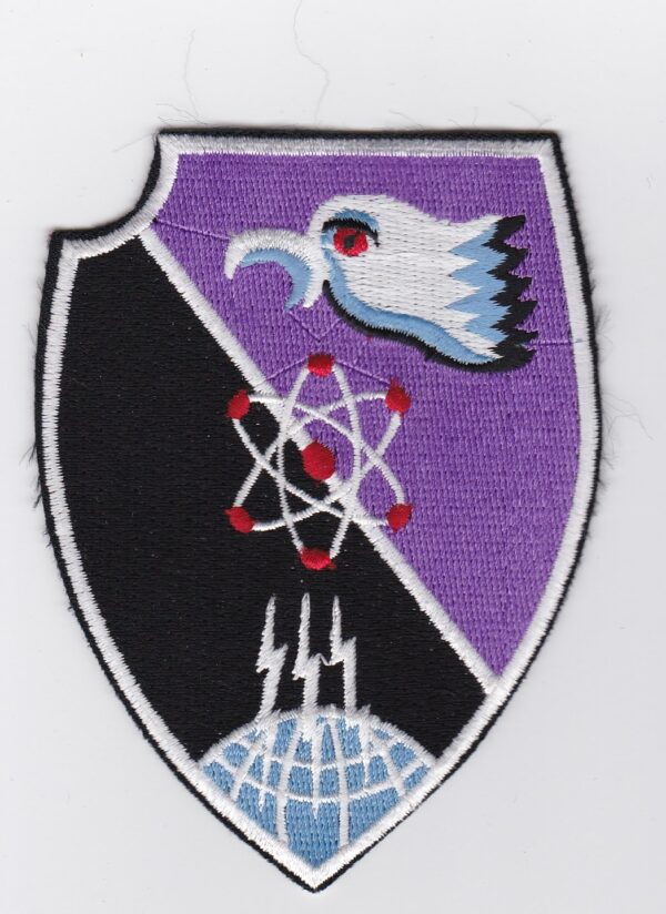 A purple and black patch with an eagle on it.