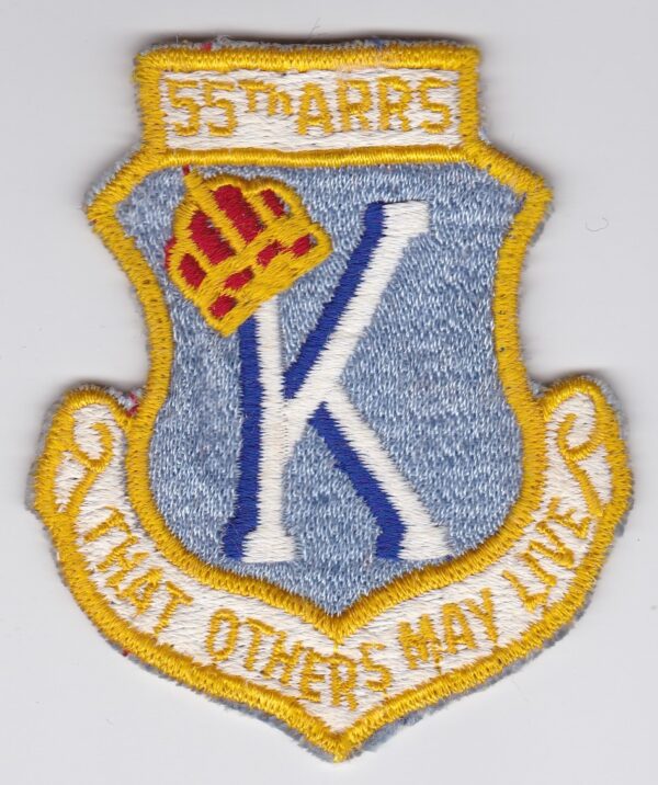 A patch with the words k that others may live on it.