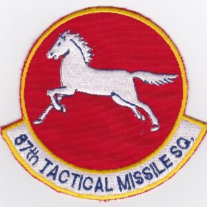 A red and white patch with a horse on it.