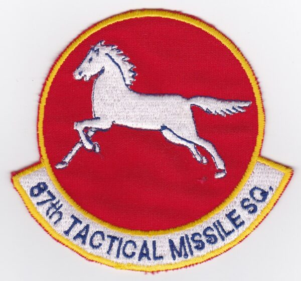 A red and white patch with a horse on it.