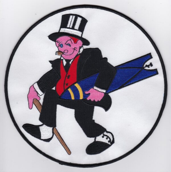 A round patch with a man in a top hat and a cane.