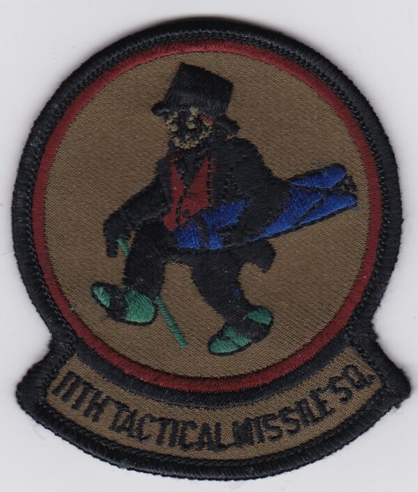 A patch with an image of a man in a top hat.