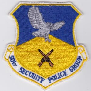 A blue and yellow patch with an eagle on it.