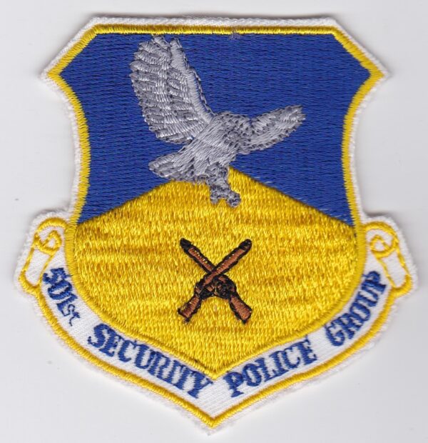 A blue and yellow patch with an eagle on it.