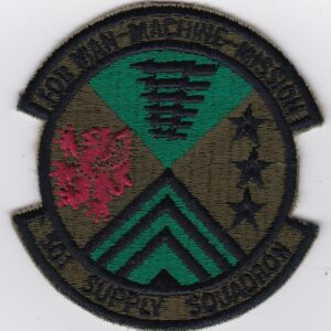 A patch with a green and red emblem on it.