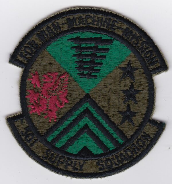 A patch with a green and red emblem on it.