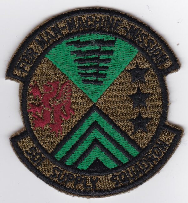 A patch with a green and red emblem on it.