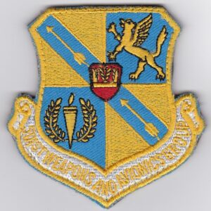 A blue and yellow patch with the emblem of the air force.