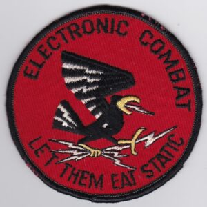 A patch with the words electronic combat let them eat steak.