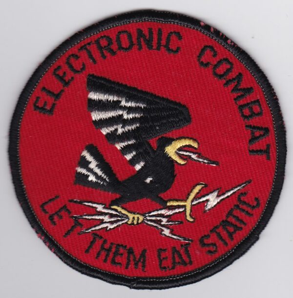 A patch with the words electronic combat let them eat steak.