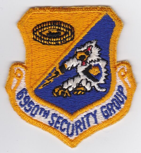 An air force security group patch on a white surface.