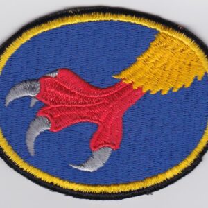 A blue and yellow patch with a claw on it.