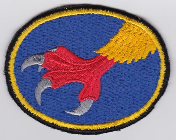 A blue and yellow patch with a claw on it.