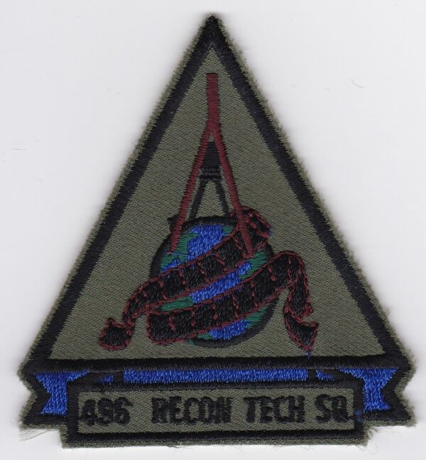 A triangle patch with the words recon tech ss.