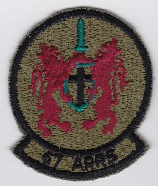 A patch with a lion and a cross on it.