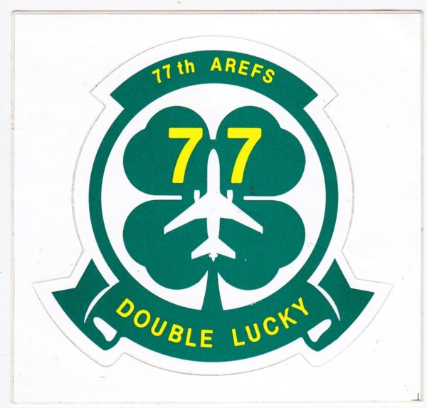 A sticker with the words tin aire 77 double lucky.