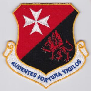 A red and black patch with a dragon on it.