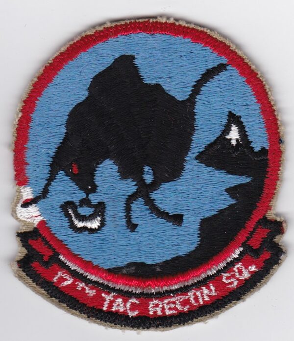 A patch with an image of a dog on it.