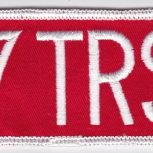 A red and white patch with the word 17 trs on it.