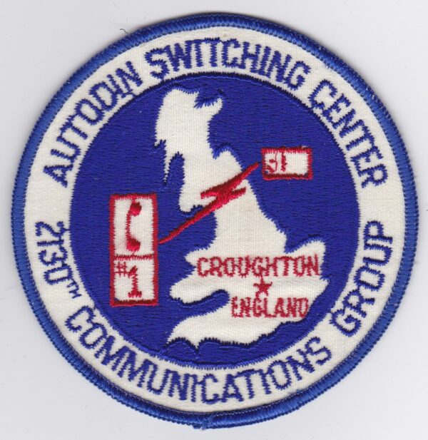 A patch with the words auton switching center england communications.