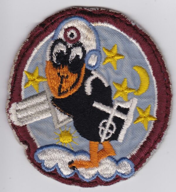 A patch with an image of a bird with a gun.