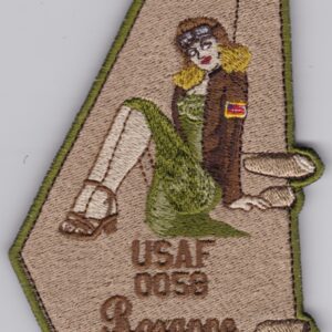 A patch with a woman in a dress on it.