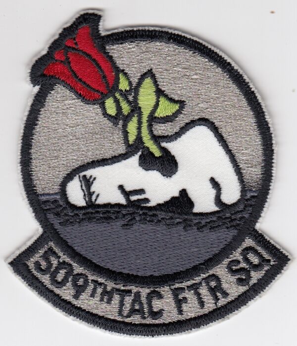 A patch with a rose on it.