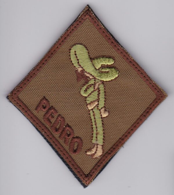 A brown patch with the word pedro on it.