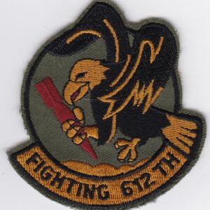 A patch with an eagle and a gun.